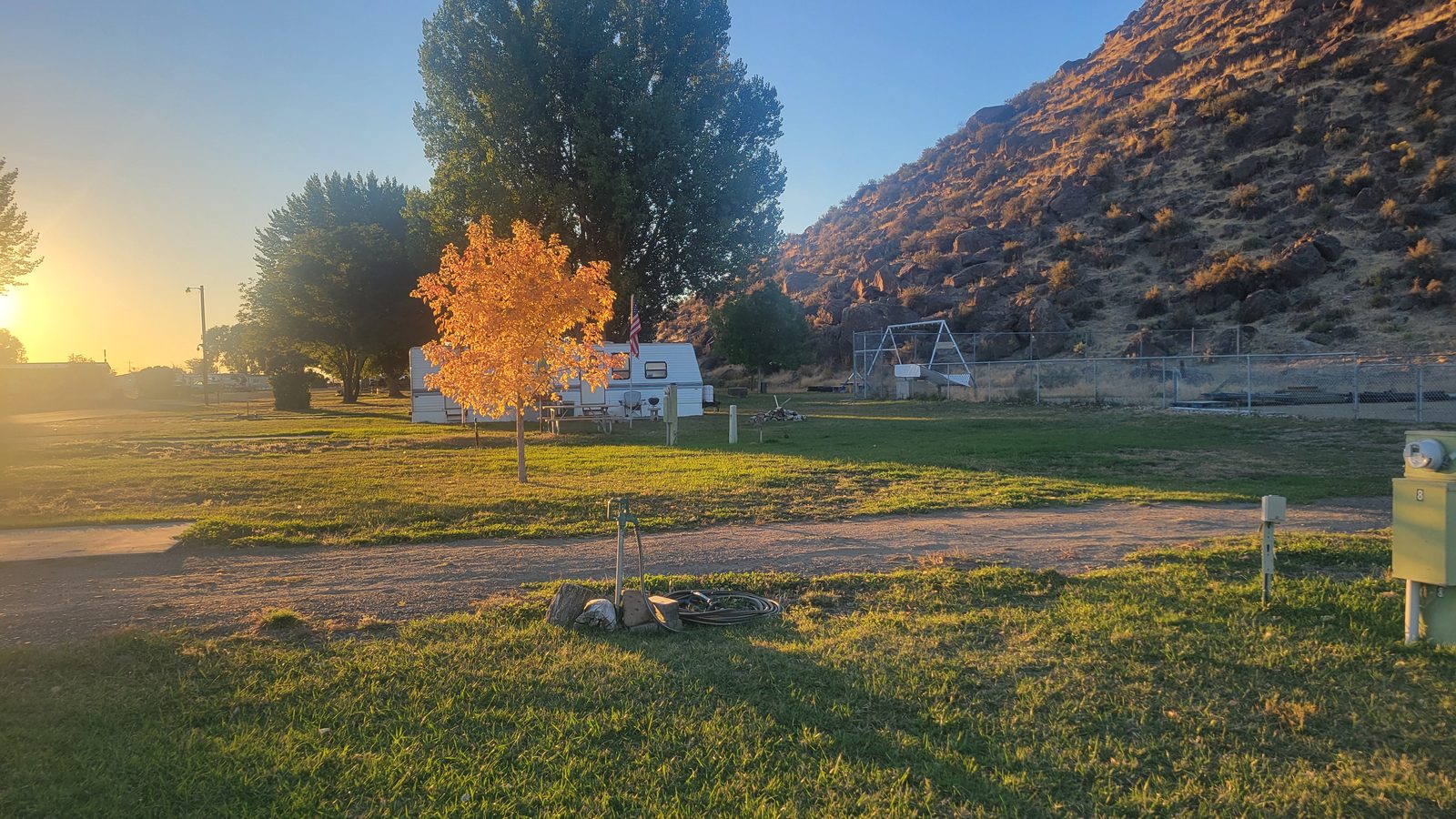 Autumn light over the park at sunset