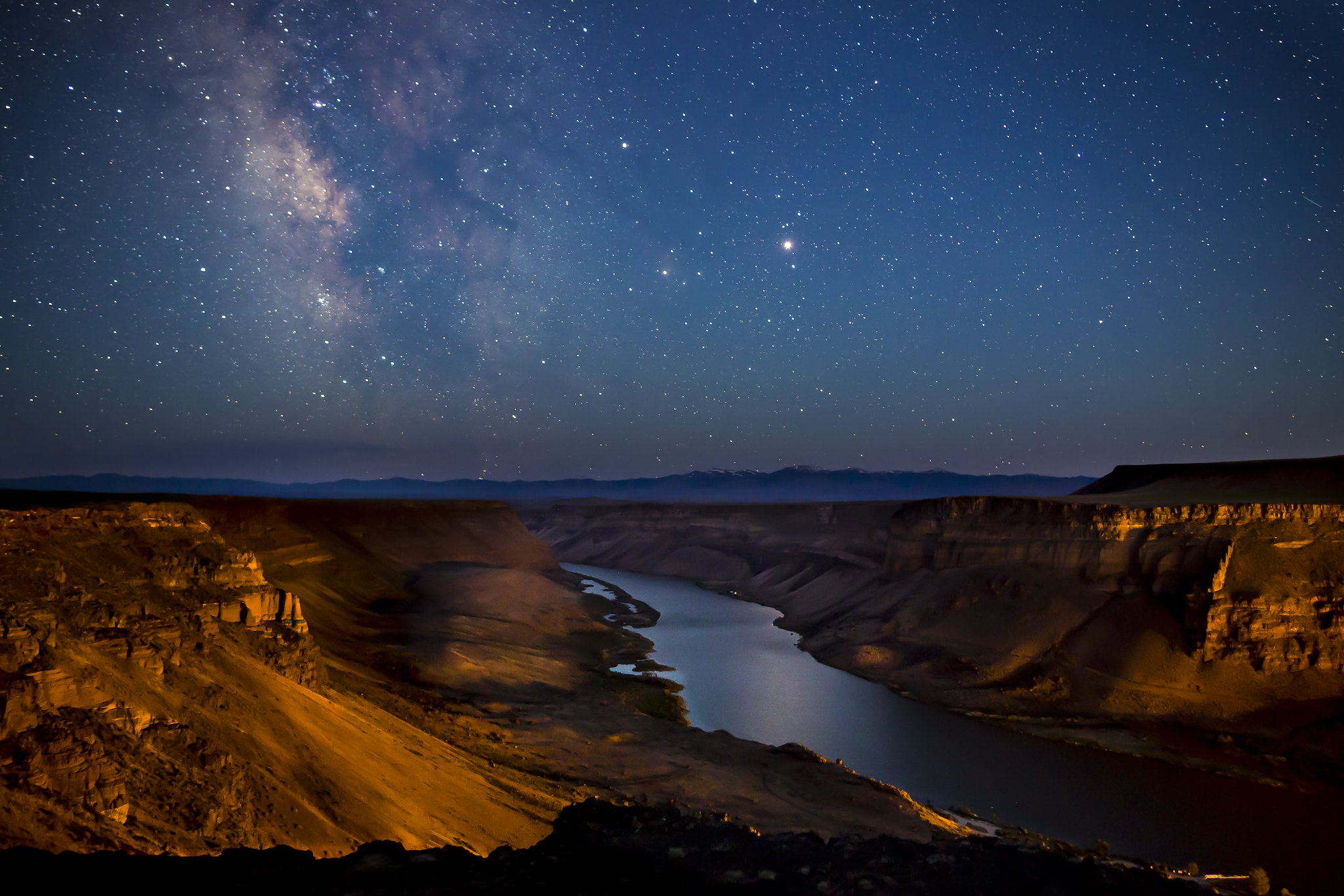 The Milky Way arching over the dark high desert of the Owyhee canyonlands on a moonless night